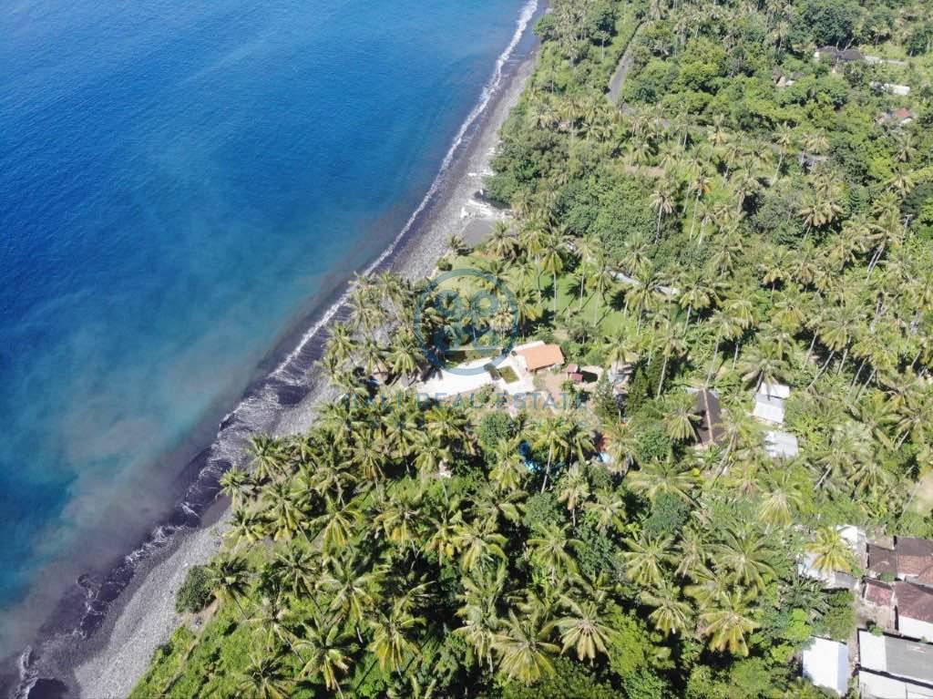 are land absolute beachfront in seraya for sale